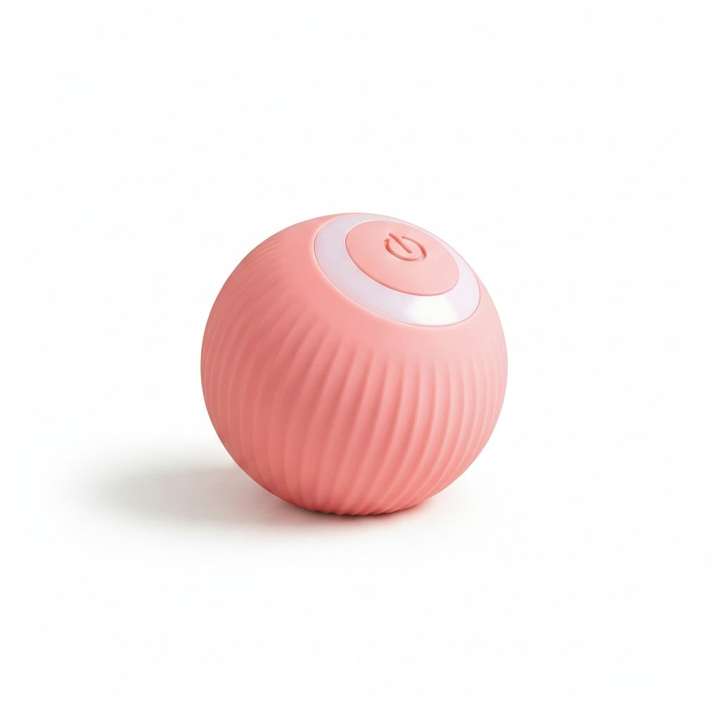 A small spherical pink device with a ribbed textured surface and a white circular top panel featuring a power button icon, shown on a clean white background.