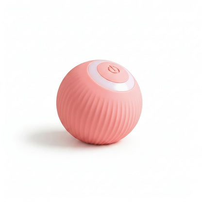 A small spherical pink device with a ribbed textured surface and a white circular top panel featuring a power button icon, shown on a clean white background.