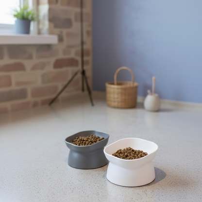 "VelvaroPets grey and white tilted pet bowls with kibble in a cozy home setting"
